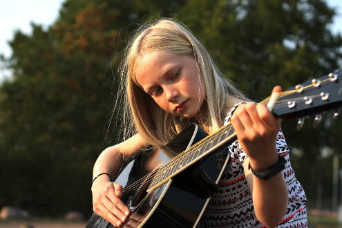 Girl Learning Guitar