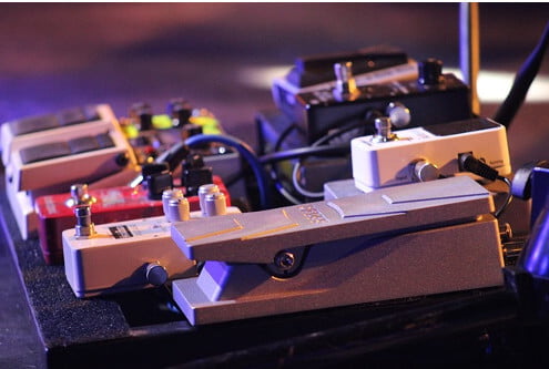 Guitar pedals on a board.